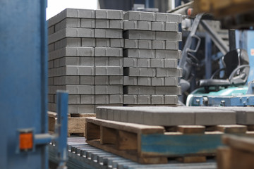Production of concrete paving stones