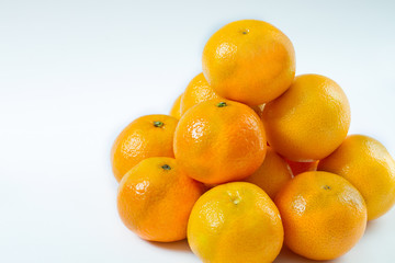 Copy space and mock up. Mandarin, tangerine citrus fruit isolated on white background.
