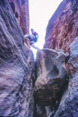 Tourist on the rocks, canyon of Khazali. Wadi Rum Desert, Jordan