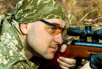  young man with an air rifle