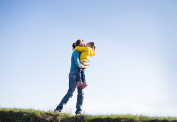 Mom and daughter on the grass