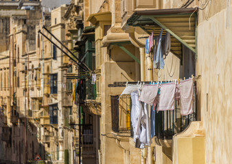 Fototapeta na wymiar laundery drying on maltese street