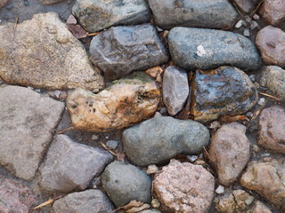 a piece of an old cobblestone road passing in an ancient city