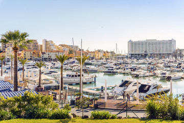 Marina full of luxurious yachts in touristic Vilamoura, Algarve, Portugal