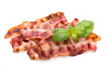 Cooked bacon rashers isolated on white.