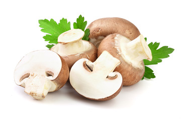 Royal Brown champignon with half and parsley leaf isolated on white background