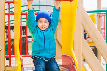 Fototapeta premium boy plays on the Playground