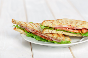 Club sandwich on wooden table