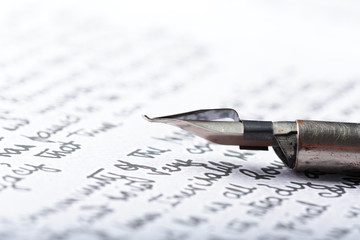 Fountain pen on an antique handwritten letter