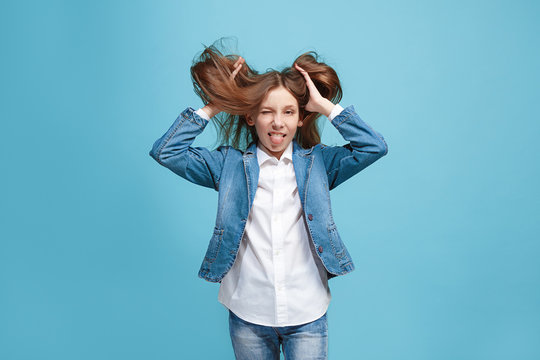 The Squint Eyed Teen Girl With Weird Expression Isolated On Blue