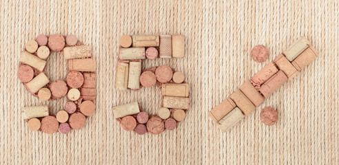 Number ninety five 95 %  percent made of wine corks on sea twine background. Sale Banner