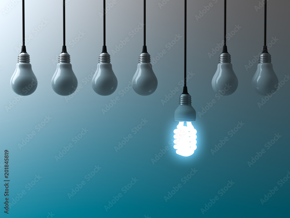 Aufkleber one hanging eco energy saving light bulb glowing and standing out from unlit light bulbs on dark gre
