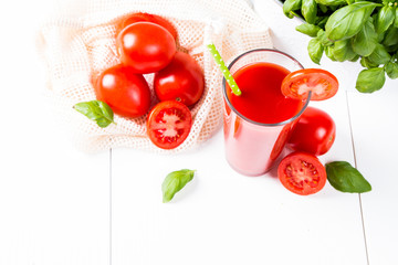 Fresh tomato juice on white background
