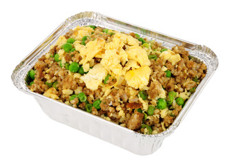 Chinese egg fried rice in a foil take away container isolated on a white background