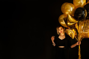 Happy Girl with Balloons and Champagne. Great Copy Space for Golden Text
