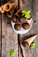 Ice cream, Chocolate scoop ice cream in cone on wooden table. 