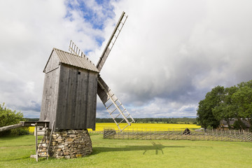 Fototapeta premium Old windmill in Angla Heritage Culture Center. A Dutch-style windmills at Saaremma island Estonia