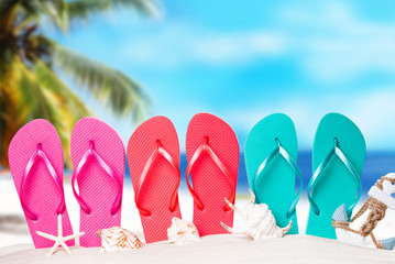 Summer concept, flip-flops, summer accessories on summer beach