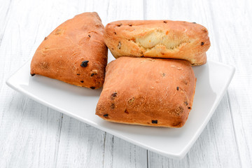 Homemade cheese buns in bowl. vintage wooden background