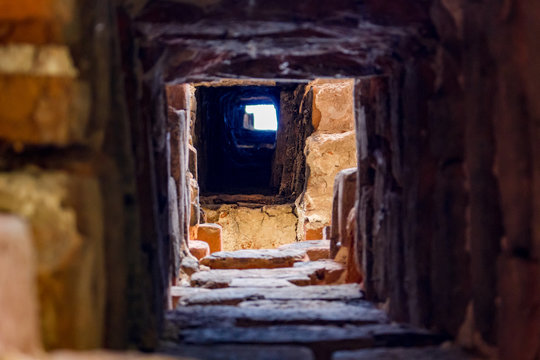 A chimney in an old brick house of the 18th century
