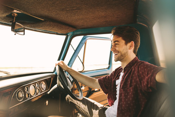 Man on vacation driving his car