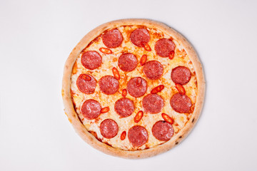 Pizza pepperoni isolated on white. Top view