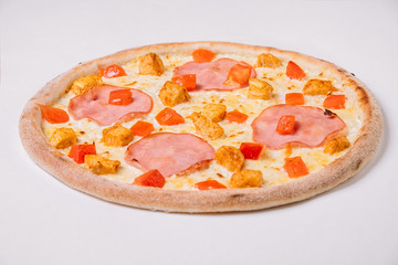 Pizza with chicken and ham isolated on white