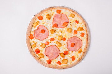 Fototapeta na wymiar Pizza with chicken and ham isolated on white. Top view