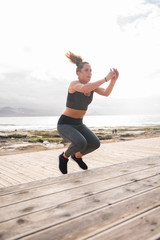 Sporty young woman doing fitness training