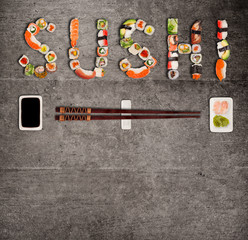 Obraz premium Traditional japanese sushi pieces making inscription.