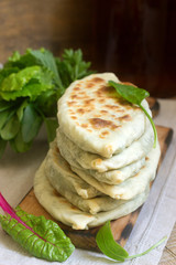Baker making traditional dish of Armenians from Artsakh Zhingyalov hats is a type of flatbread stuffed with herbs.