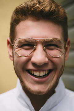 Crazily expressive man in glasses