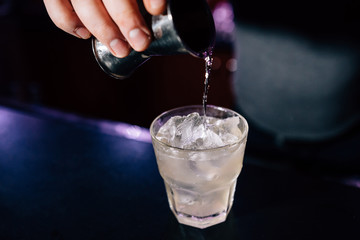 bartender prepares a cocktail