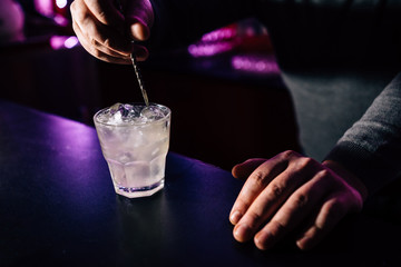 bartender prepares a cocktail