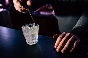 bartender prepares a cocktail