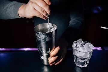 bartender prepares a cocktail