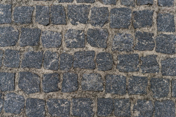Dirty pebble stones road surface