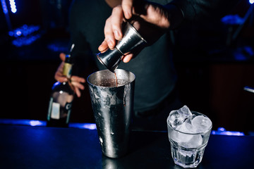 bartender prepares a cocktail