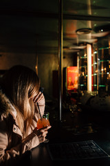 a girl drinks a cocktail