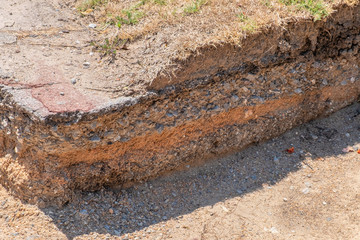 layer of soil and road before repairing