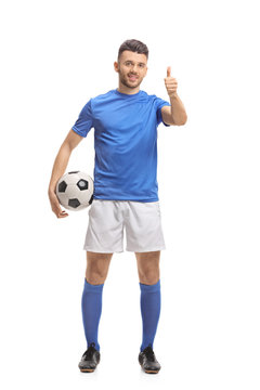 Soccer Player Holding A Football And Making A Thumb Up Sign