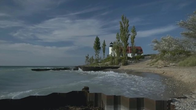 Point Betsie light house under blue sky standind watch over lake Michigan travel destination