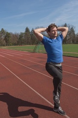 Adult male athlete on track after running