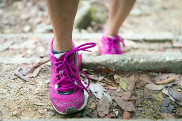 Close up of woman hiking shoes on steps