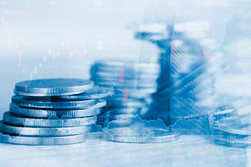 Rows of coin and graph of stock market trade indicator financial for investment strategy.