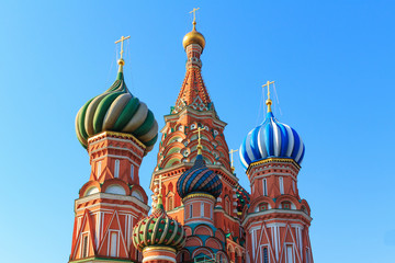 Fototapeta na wymiar Dome of St. Basil's Cathedral on a blue sky background. Sunny morning in Moscow