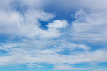 Naklejka na ściany i meble Beautiful background of blue sky with white clouds