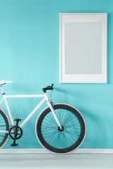 White bicycle in blue anteroom