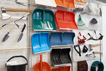 Plastic shovels and other household goods in store