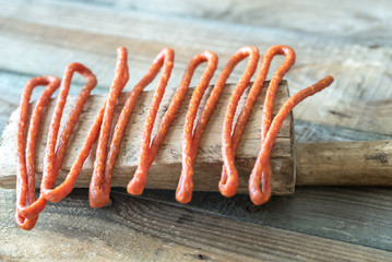 Smoked sausages on the wooden board